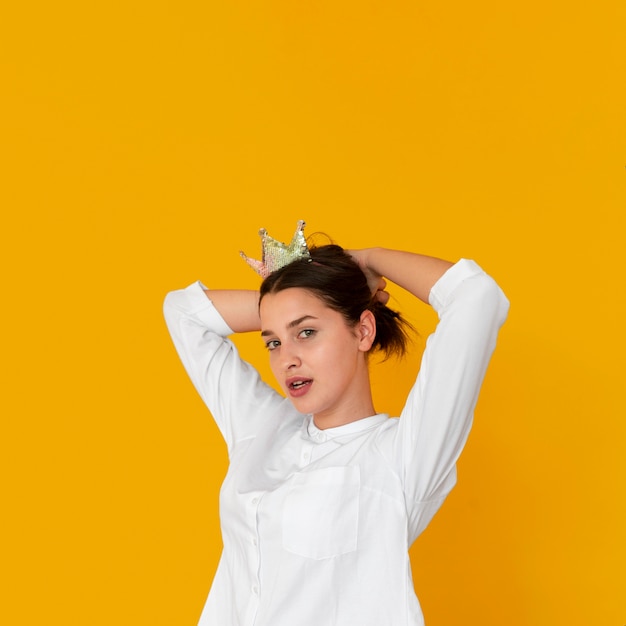 Front view of girl wearing a crown with copy space
