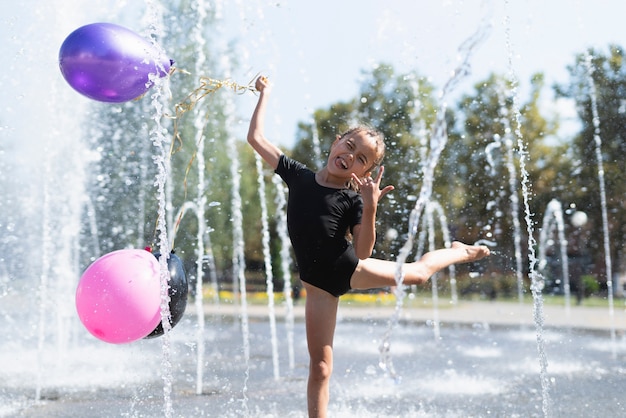 Free photo front view of girl with balloons