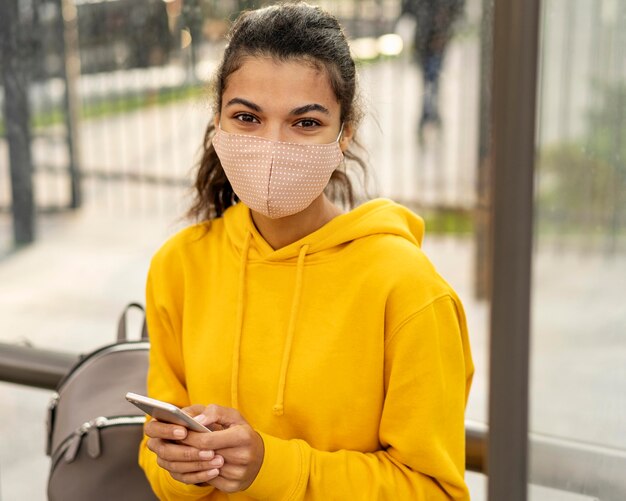 Front view of girl with face mask on street