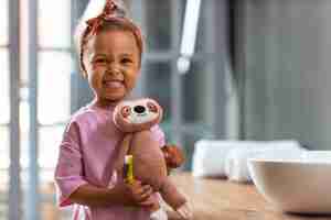 Free photo front view girl with stuffed toy