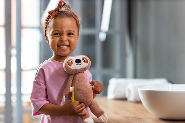 Front view girl with stuffed toy