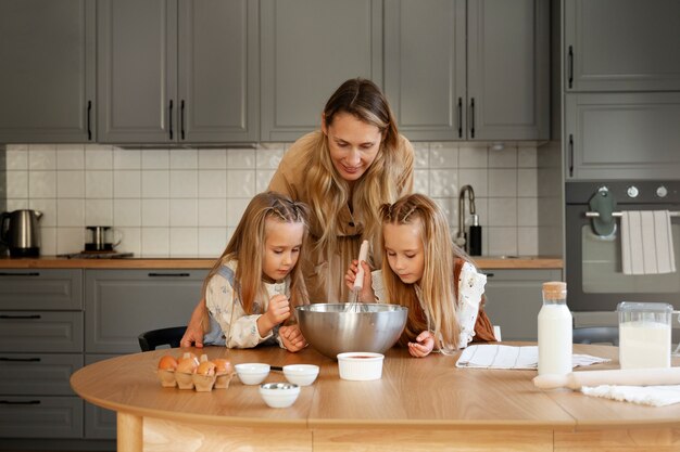 Front view girls cooking together