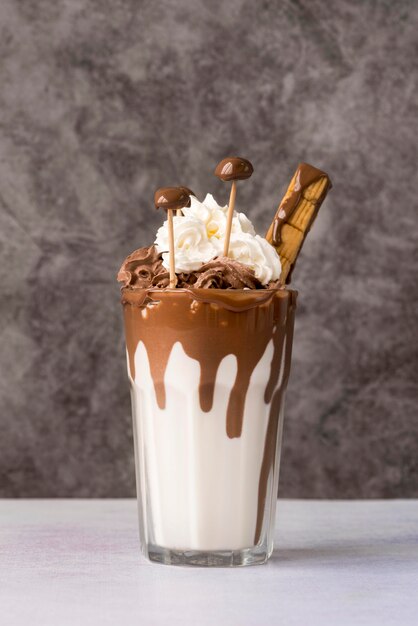 Front view of glass of dessert with chocolate