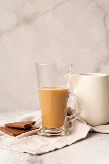 Front view glass of milk coffee with chocolate