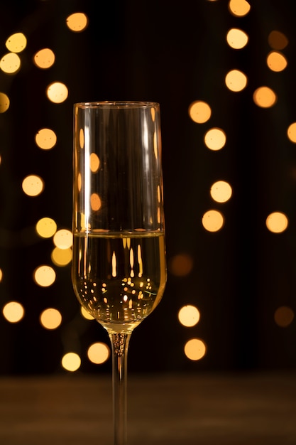 Front view glass with champagne on new year party