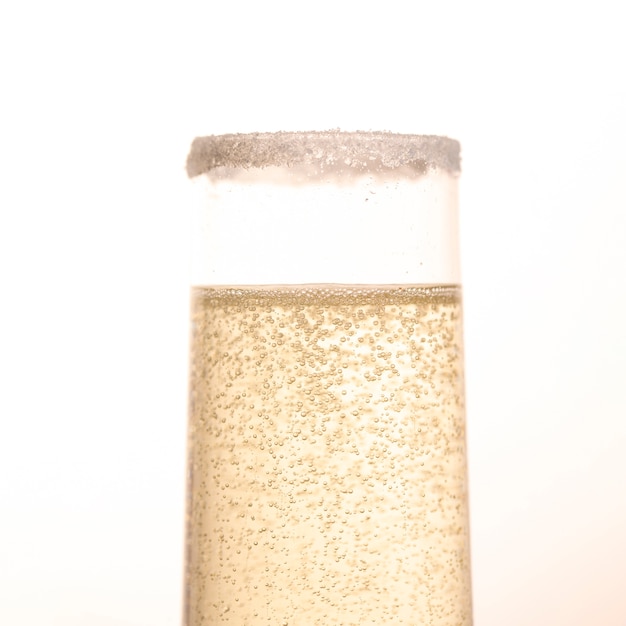 Front view glass with sparkle champagne bubbles