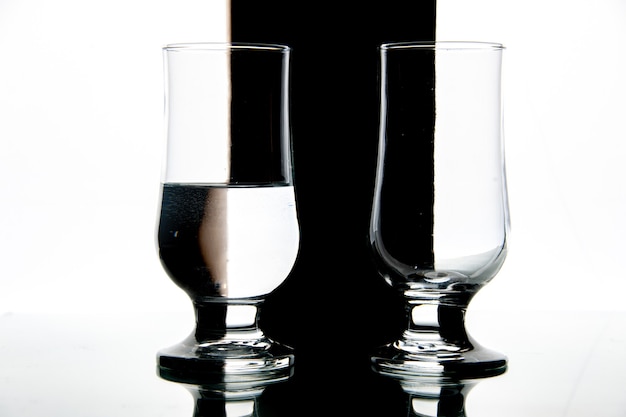 Front view glasses of water on black-white drink wine photo transparent