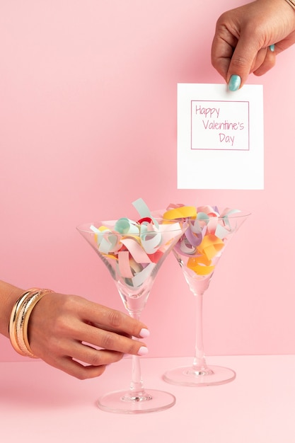 Free photo front view of glasses with confetti for valentine's day