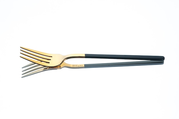 front view golden fork on white background
