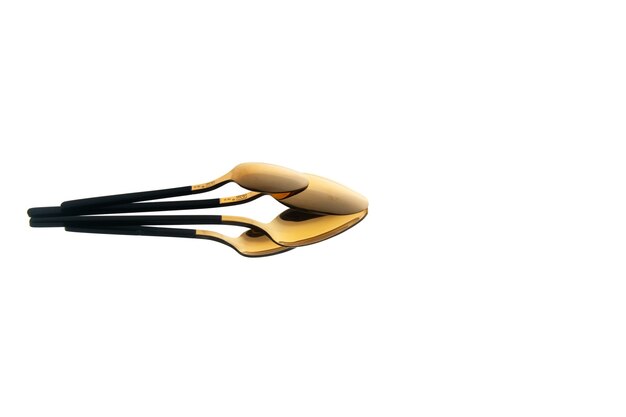 front view golden spoon on white background
