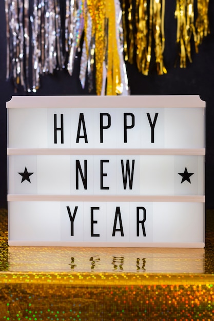 Free photo front view golden theme for new year