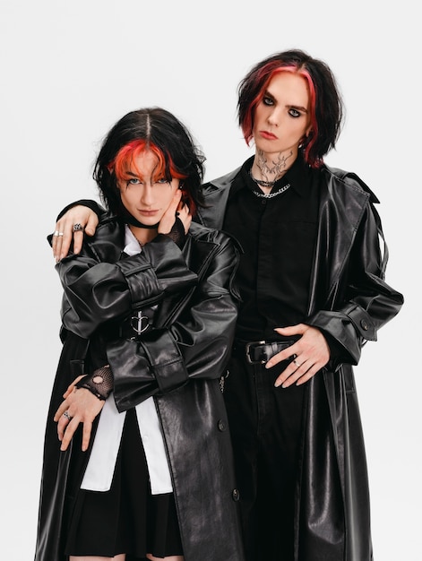 Free photo front view goth friends posing in studio