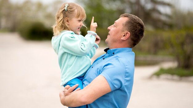 Front view of granddaughter and grandfather