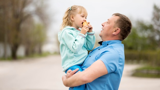 Free photo front view of granddaughter and grandfather