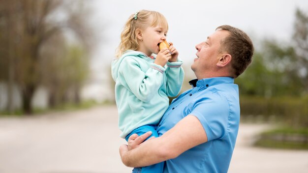 Front view of granddaughter and grandfather