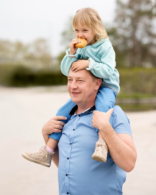 Front view of granddaughter and grandfather