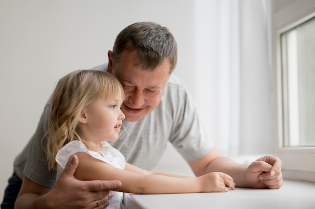 Front view of granddaughter and grandfather