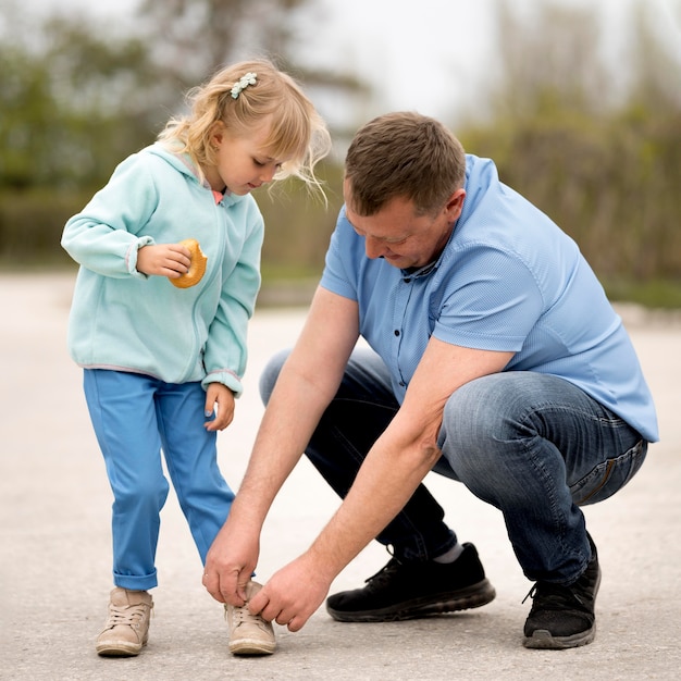 Front view of grandfather and granddaughter