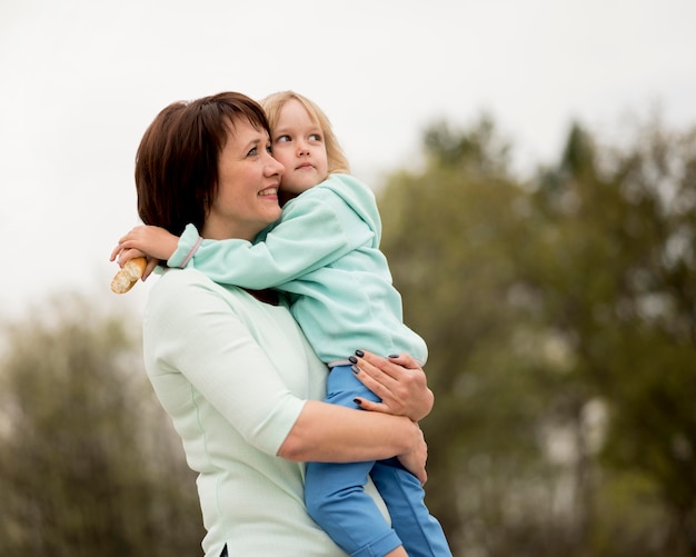 Free photo front view of grandmother and granddaughter