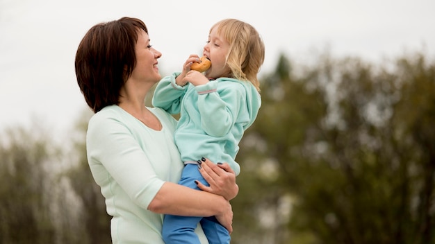 Front view of grandmother and granddaughter