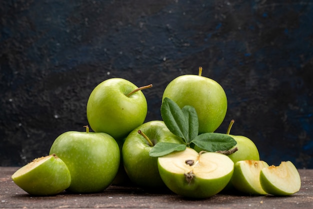 A front view green apple fresh and mellow on the dark background fruit color vitamine healthy