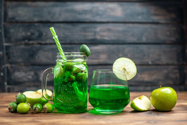 Front view green feijoa juice with green apple on a dark bar fruit color photo cocktail drink