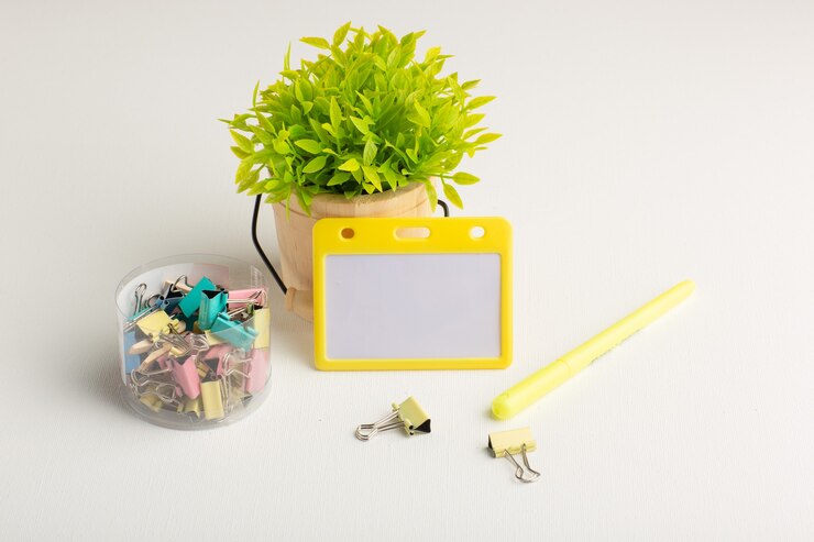 Free Photo front view green plant with stickers on white surface
