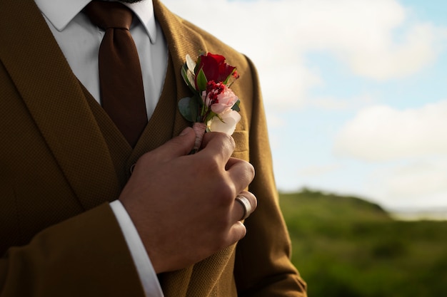 Front view groom posing in nature