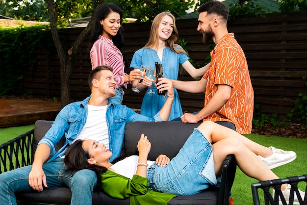 Front view group of friends together outdoors