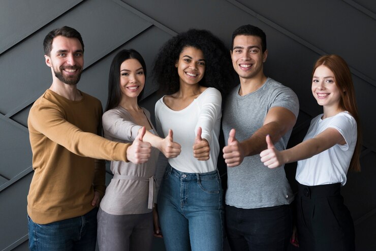 Free Photo front view group of young people with thumbs up