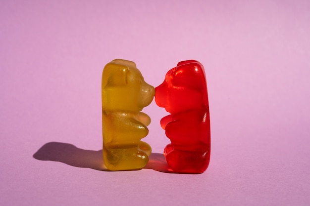 Free photo front view of gummy bear candy kissing