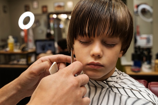 Front view hairdresser holding comb