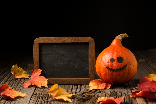 Front view halloween pumpkin with leaves