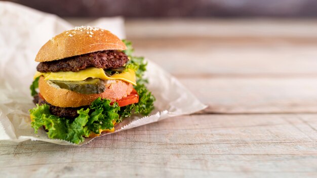 Front view hamburger with wooden background