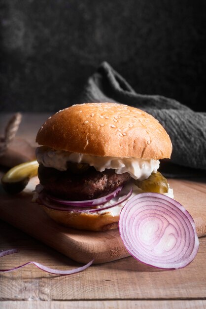 Front view hamburger on wooden board