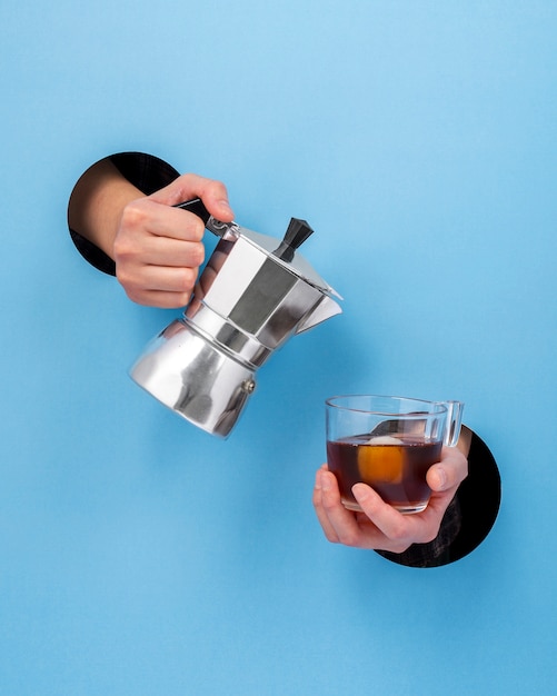 Front view hand holding hot beverage