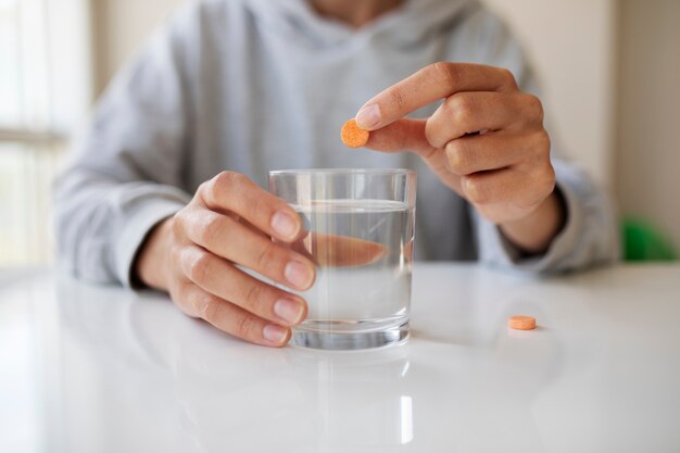 Front view hand holding pill