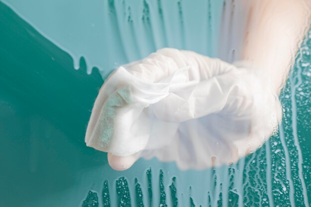 Front view of hand with surgical glove cleaning window