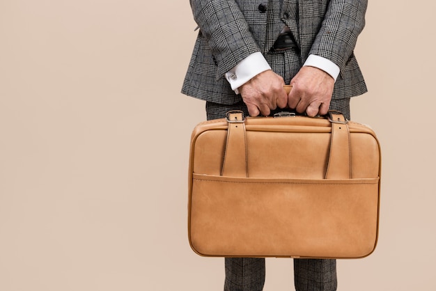 Front view hands holding baggage