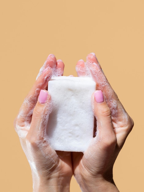 Front view of hands washing with soap