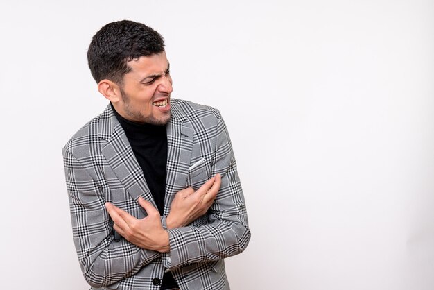 Front view handsome male in suit crossing hands standing on white background