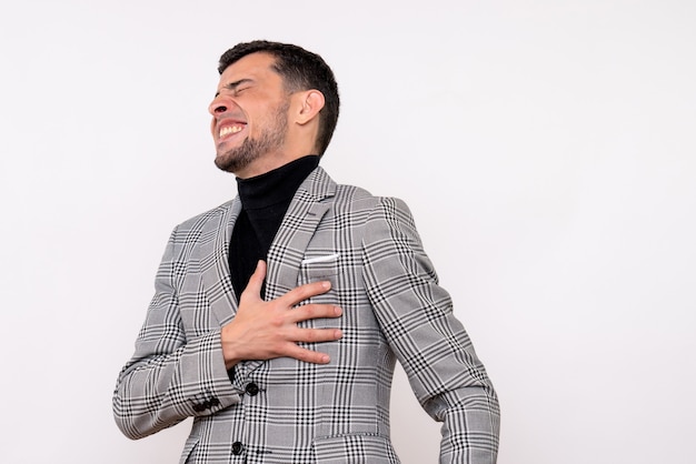 Free photo front view handsome male in suit holding his chest with pain standing on white background