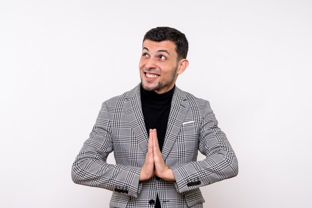 Front view handsome male in suit joining hands together standing on white background