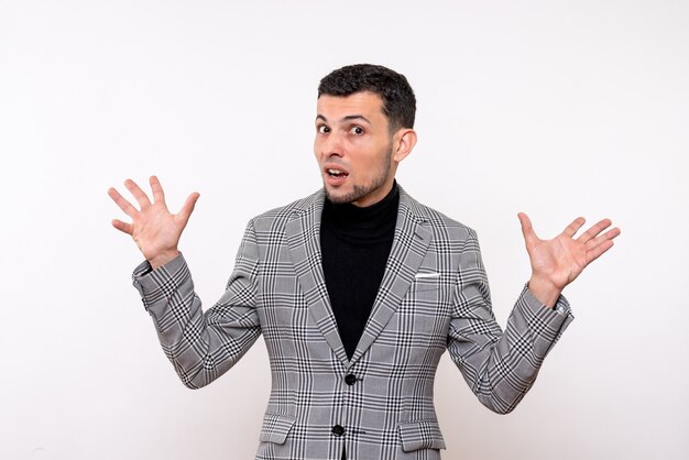 Front view handsome male in suit opening hands standing on white background