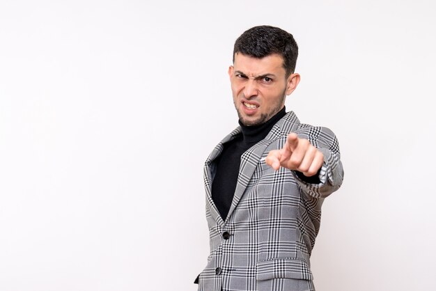 Front view handsome male in suit pointing at camera standing on white background