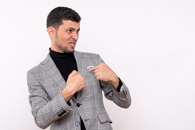 Front view handsome male in suit pointing at himself standing on white isolated background