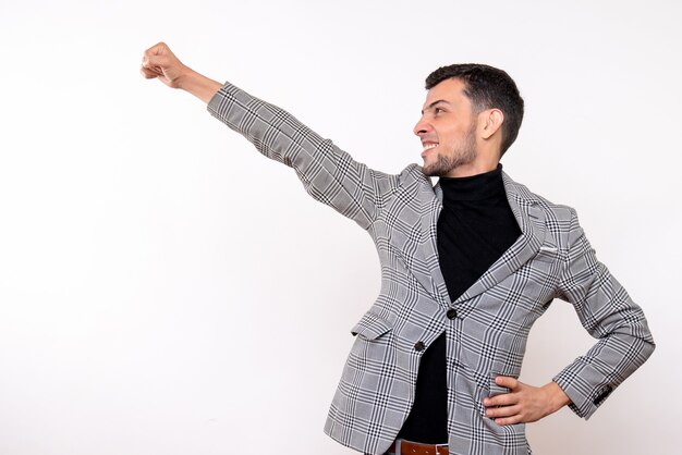 Front view handsome male in suit showing super hero gesture standing on white background