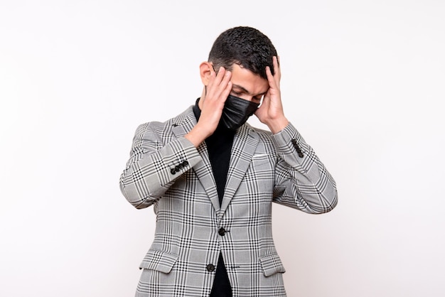 Front view handsome man in suit holding head standing on white isolated background