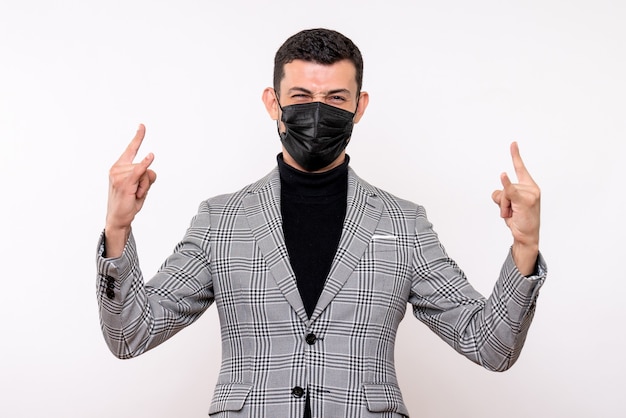 Free photo front view handsome man in suit making wolf sign standing on white isolated background