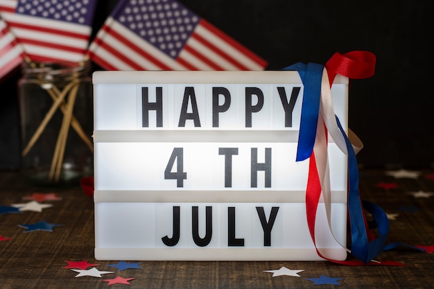 Front view happy 4th july sign with flags